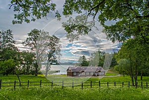 scenic landscape of wooden house near lake