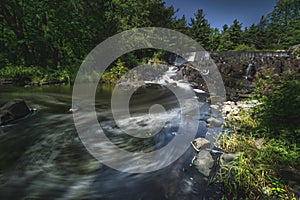 Scenic landscapes of waterfalls and cascades over rocks and moss in the Niagara region of Ontario Canada