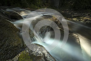 Scenic landscapes of waterfalls and cascades over rocks and moss in the Niagara region of Ontario Canada