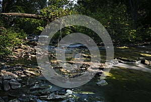 Scenic landscapes of waterfalls and cascades over rocks and moss in the Niagara region of Ontario Canada