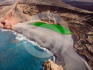 Scenic lanscape with volcanic crater with green lake in El Golfo, Lanzarote. Aerial view