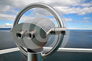 Scenic lookout Binoculars at the sea photo