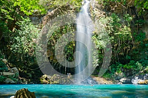 Scenic low angle shot of a waterfall from Rincon de la Vieja Volcano National Park in Costa Rica photo