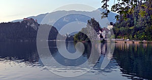 Scenic morning view of St. Martin`s Parish Church near Bled Lake. Beautiful autumn weather during sunrise.