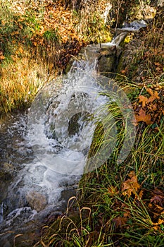 Scenic mountain autumn landscape with river and waterfalls, P