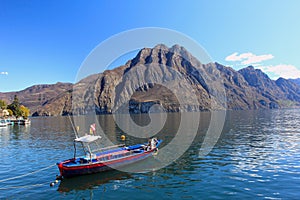 Iseo lake, boat on the mountain background photo