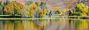 Scenic mountain lake with colorful autumn trees at Wasatch mountain state park in Utah