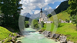 Scenic mountain landscape in the Bavarian Alps with famous Parish Church of St. Sebastian in the village of Ramsau, Nationalpark