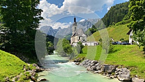 Scenic mountain landscape in the Bavarian Alps with famous Parish Church of St. Sebastian in the village of Ramsau, Nationalpark