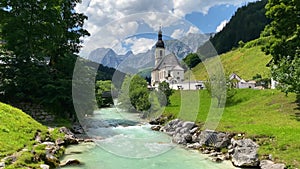 Scenic mountain landscape in the Bavarian Alps with famous Parish Church of St. Sebastian in the village of Ramsau, Nationalpark