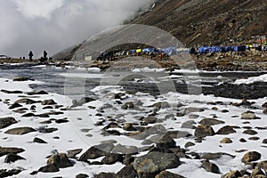 scenic mountain landscape and snow covered river valley at zero point or yumesodong, surrounded by snow clad himalaya mountains