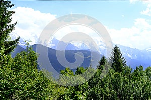 Scenic mountain, mountain range in france, Graian Alps, beautiful natural landscape of Mont Blanc in summer framed by green trees