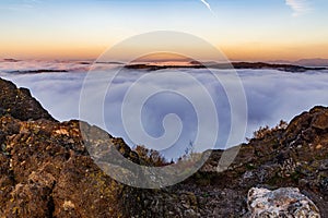 Scenic mountainous landscape hidden in a sea of clouds. Kremnica Mountains, Slovakia.