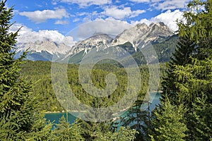 Scenic mountains and emerald lake panorama landscape