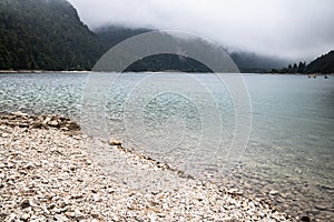 Scenic mystical cloudy lago di predil, italy photo