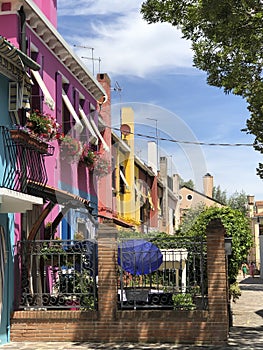 Scenic narrow colorful houses at the venetian island of Burano