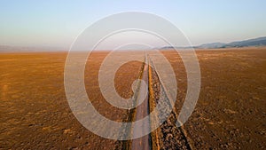 Scenic narrow road passing through remote Carrizo plain national monument in California