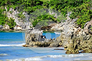 Tropical lanscape with boat and ocean cliff