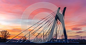Scenic night aerial drone view of sunset sky with silhouette of bridge, Krakow, Poland