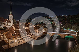 Scenic night aerial view of Bern's old town seen from Rose Garden viewpoint, Switzerland.