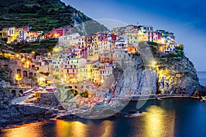 Scenic night view of colorful village Manarola in Cinque Terre