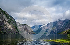Scenic Norway fjord landscape and kayak on the water. Eidfjord. photo
