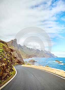 Scenic ocean drive by cliffs of the Macizo de Anaga, Tenerife photo