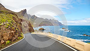 Scenic ocean drive by cliffs of the Macizo de Anaga, Tenerife photo