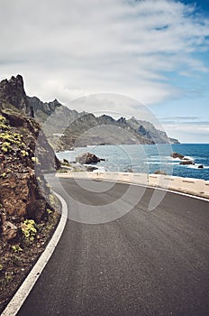 Scenic ocean road by cliffs of the Macizo de Anaga mountain range, Tenerife, Spain photo