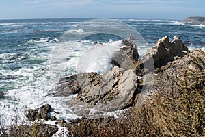 Scenic ocean view of Point Lobos State Reserve in California, near Monterey along the Pacific Coast Highway, as waves crash into