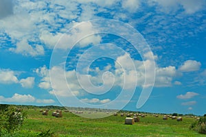 Scenic panorama with hay bales