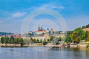 Scenic panorama of the Old Town architecture with Vltava river and St.Vitus Cathedral in Prague, Czech Republic