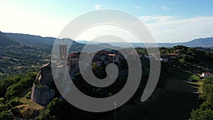 Scenic panoramic landscape from air overlooking the architecture. Group of houses on top of the mountain, aerial drone view