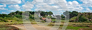 Scenic panoramic landscape with houses and rocks at Pors Hir, CÃ´tes d`Armor, Brittany France