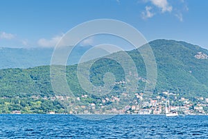 Scenic panoramic landscape view on Bay of Kotor, Montenegro with mountains at sundown.