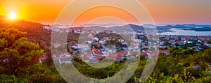 Scenic panoramic view of Murter island in Croatia, town, sea and Kornati park in sunset light, travel background