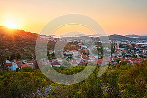 Scenic panoramic view of Murter island in Croatia, town, sea and Kornati park in sunset light, travel background