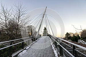 A scenic pedestrian bridge next to railway tracks and Lagard cemetery in Stavanger city centre