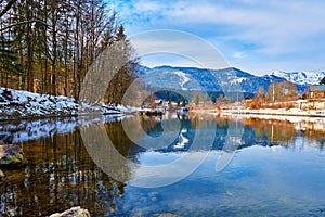 Scenic picture-postcard landscape with lake Traun, forest and mountains  in Austrian Alps. Beautiful view in winter