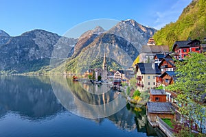 Scenic picture-postcard view of famous Hallstatt mountain village in the Austrian Alps at beautiful light in spring, Salzkammergut