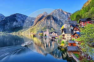 Scenic picture-postcard view of famous Hallstatt mountain village in the Austrian Alps at beautiful light in spring, Salzkammergut