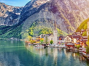 Scenic picture-postcard view of famous Hallstatt mountain village in the Austrian Alps at beautiful light in spring, Salzkammergut