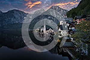 Scenic picture-postcard view of famous Hallstatt mountain village in the Austrian Alps at beautiful sunset light in spring,