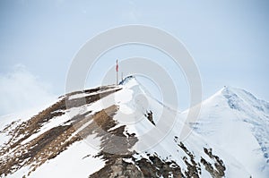 Scenic picture-postcard view of famous place, Grossglockner mountain with cloud & fog, Austria photo