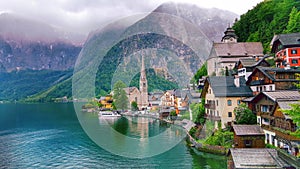 Scenic picture-postcard view of little famous Hallstatt mountain village with Hallstaetter Lake in the Austrian Alps, region of Sa