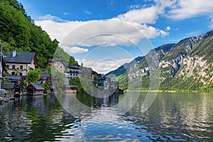 Scenic picture-postcard view of traditional old wooden houses in famous Hallstatt mountain village at Hallstattersee lake