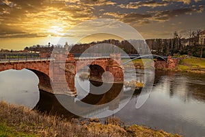 Scenic PÃ¶ppelmann bridge over the Mulde river. Old Grimma town. Germany