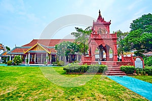The red Ho Rakang bell tower, Wat Phra That Hariphunchai Temple, Lamphun, Thailand