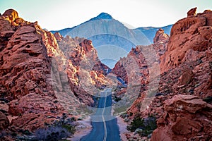 Scenic road meandering through the majesty of the orange landscape of Valley of Fire Nevada
