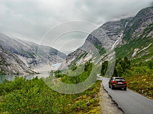 Scenic road and Nigardsbreen glacier at background, Norway
